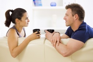 Couple talking together on couch