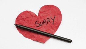 Sorry-on-paper-heart-with-pen
