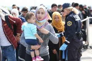 Migrants - young Syrian woman with child