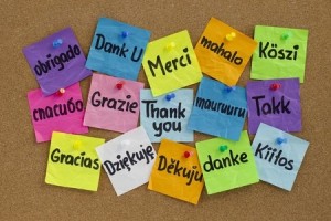 Board with stickies of Thank You in different languages
