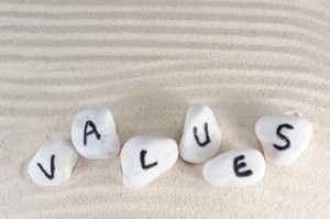Values-spelled-on-6-stones-in-sand