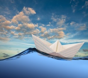 Paper-boat-drifting-on-rolling-sea