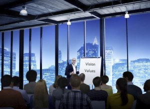 business-leader-presenting-vision-values-to-a-crowd